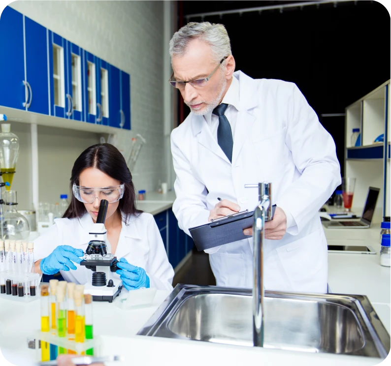 Scientists examining samples in a laboratory.